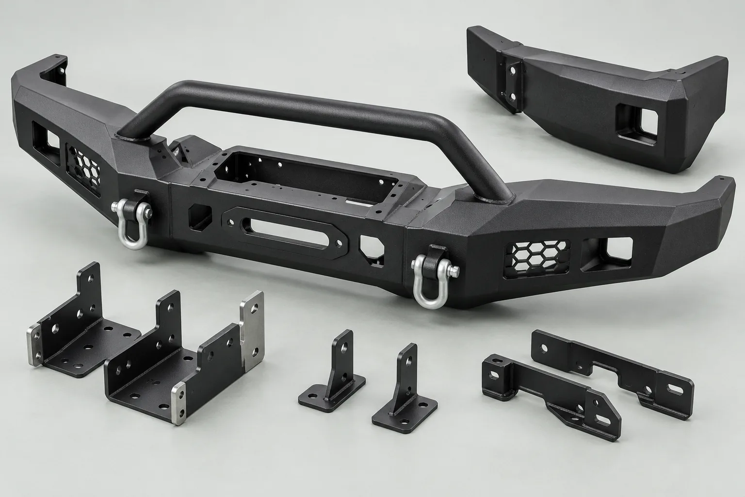 Illustrative off-road bumper assemblies and steel mounting brackets