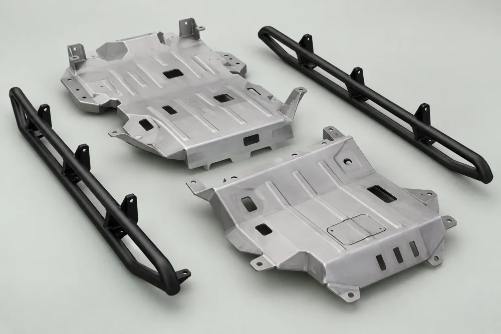 Formed underbody skid plates and tubular rocker guards