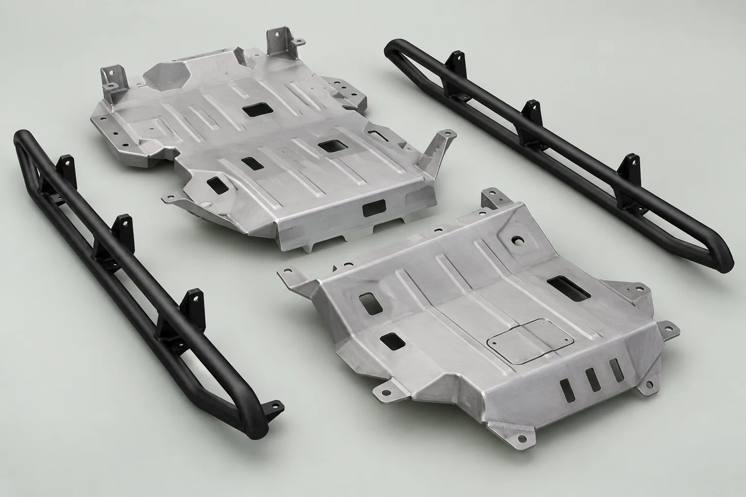 Illustrative fabricated skid plate and mounting bracket components